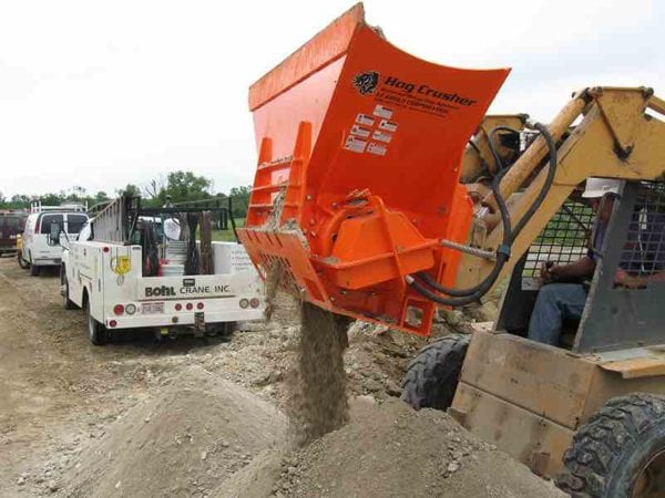 EZG Manufacturing's Hog Crusher pulverizing debris into small pieces.
